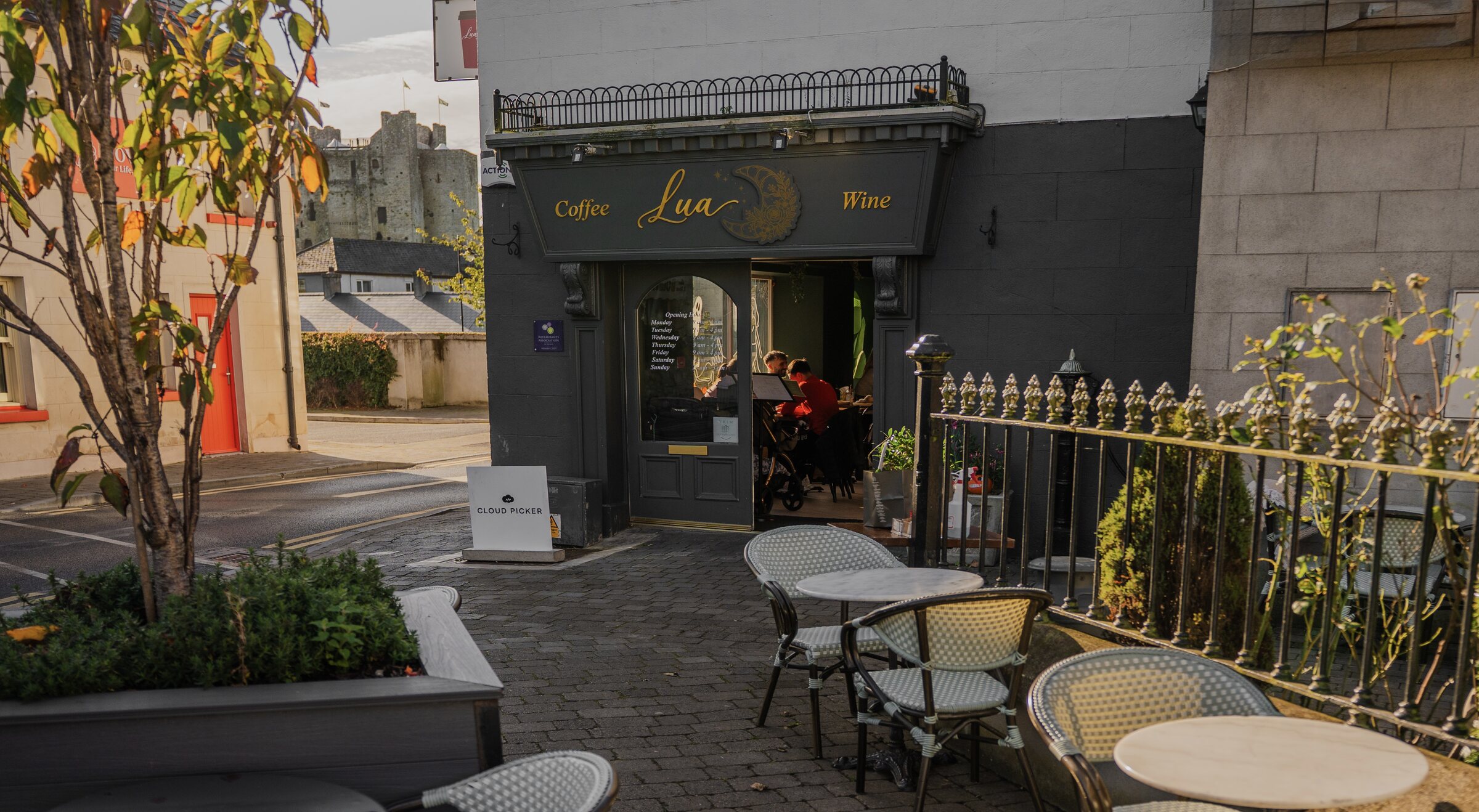 Exterior of Lua Cafe in Trim, showing the storefront entrance and outdoor seating